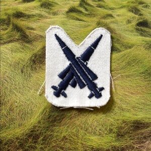 Vintage White Patch with Blue Rocket Design